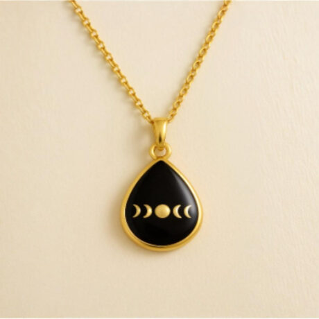 Lunar Drop Pendant - Teardrop pendant featuring a moon phase carving inside a glossy dome.