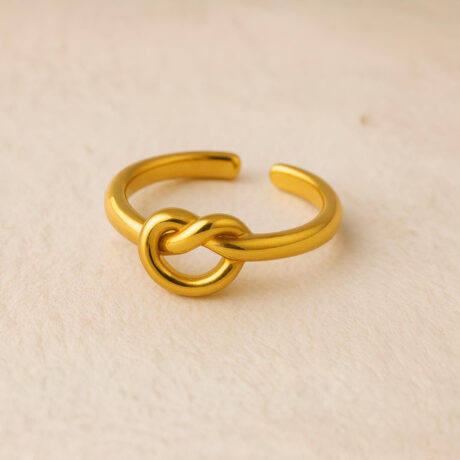 Adjustable Knot Ring - Open-ended ring featuring a modern knot motif for adjustable sizing